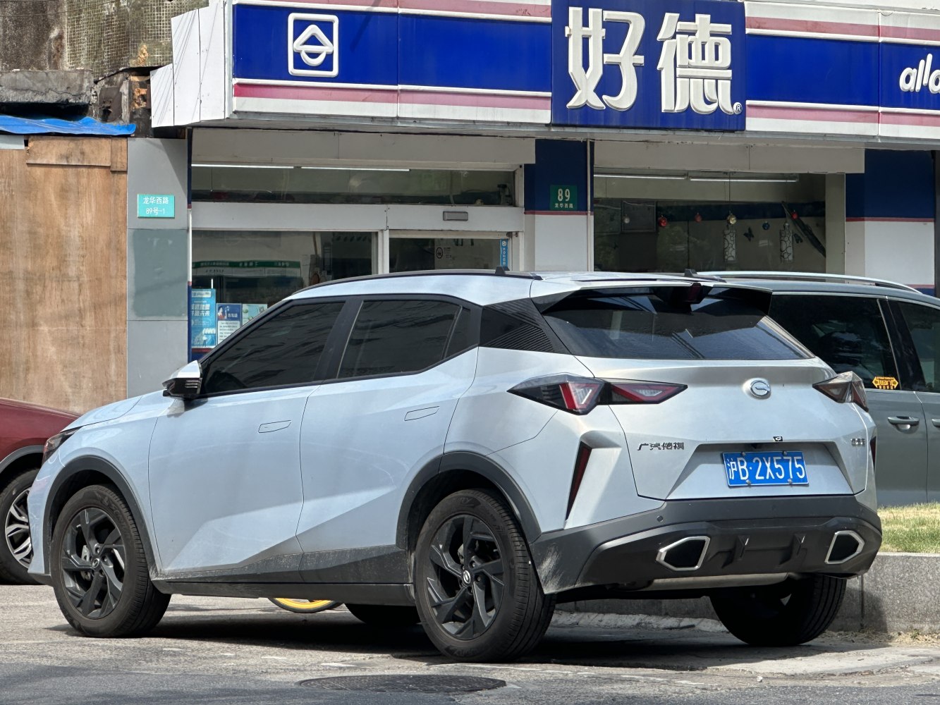Sleek modern crossover SUV rear with angular tail lights and dual exhaust outlets