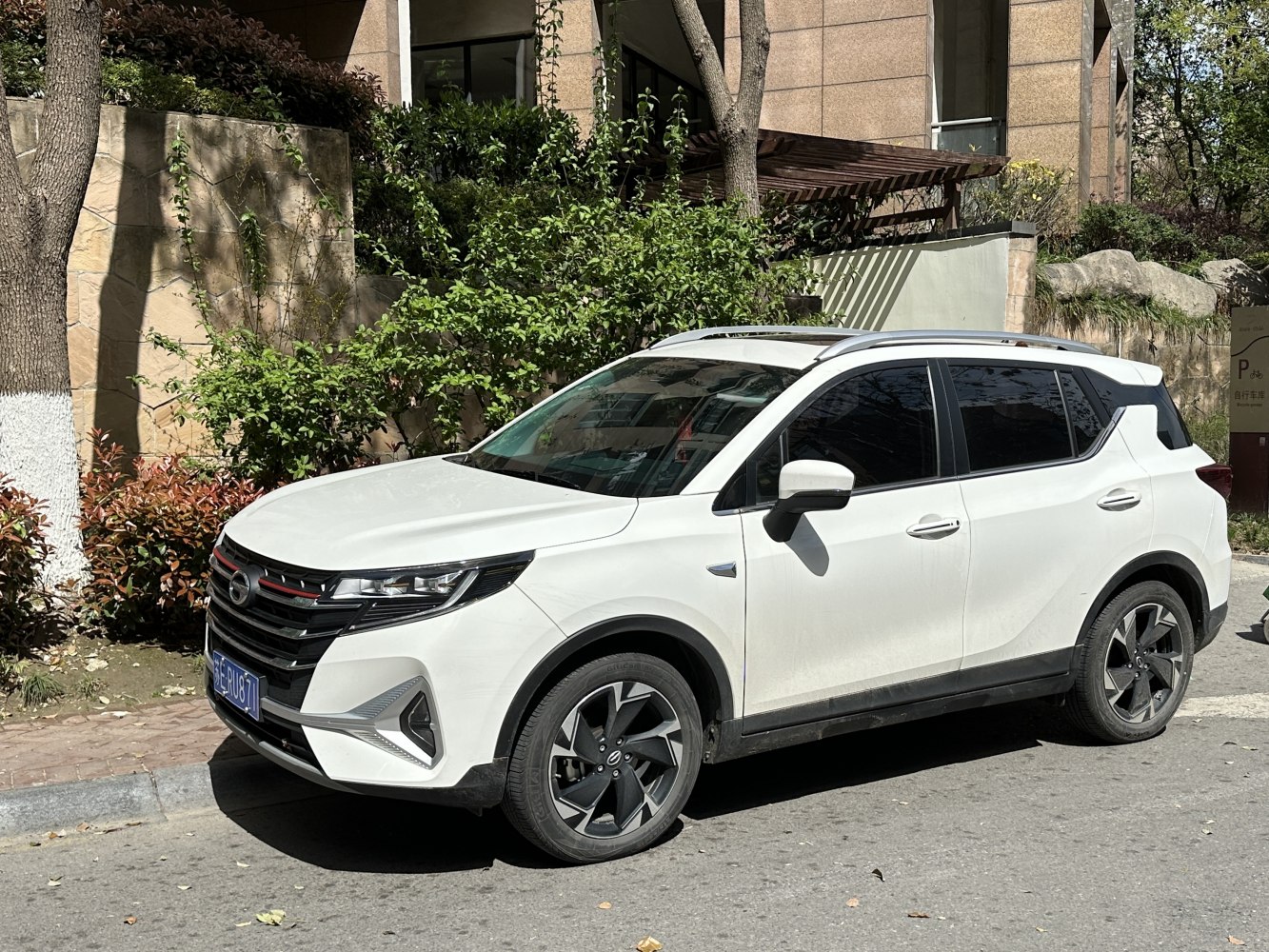 White compact SUV with sleek headlights and black alloy wheels