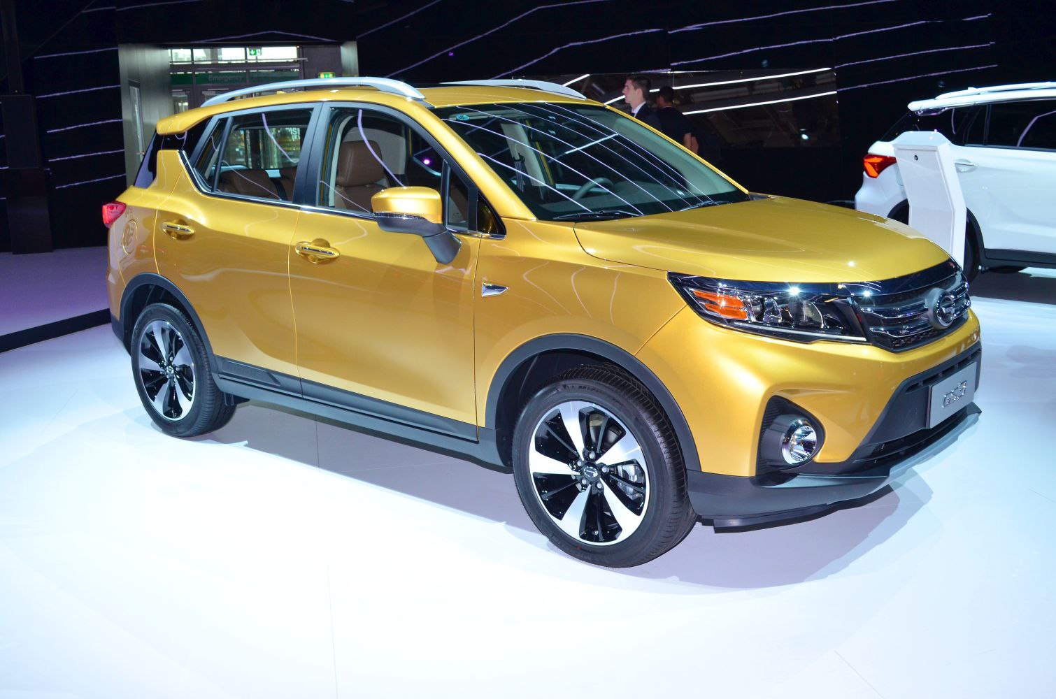 Front and side view of gold SUV with alloy wheels