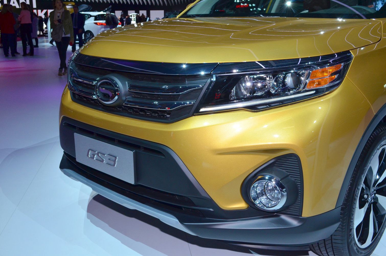 Close-up of front grille, headlight, and fog light