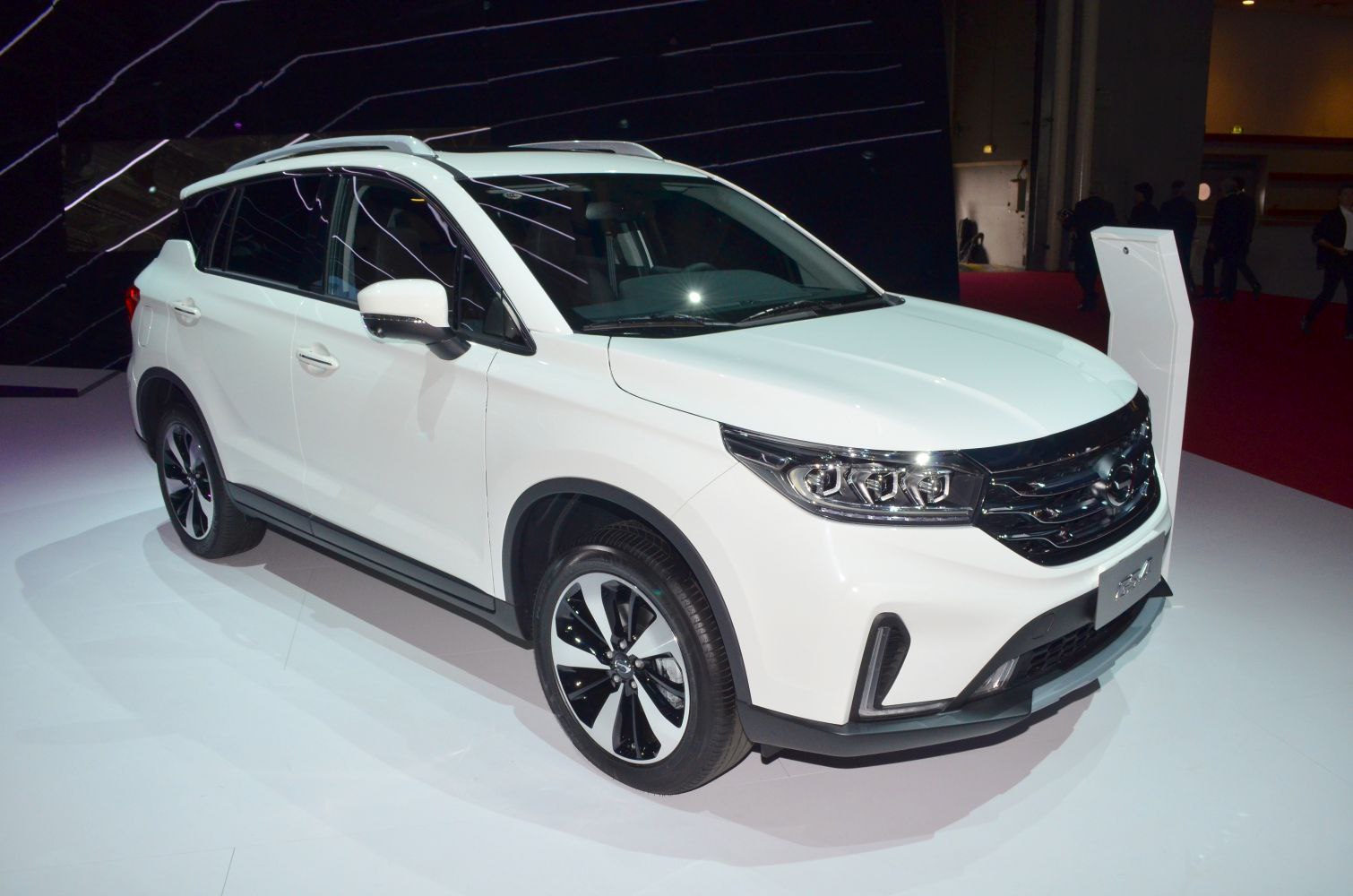White SUV front side view with LED headlights and alloy wheels