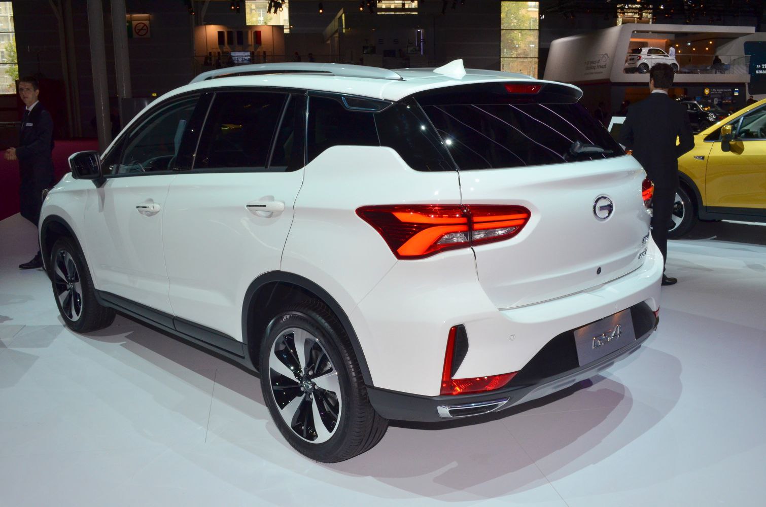 Rear view with distinctive taillights and roof spoiler