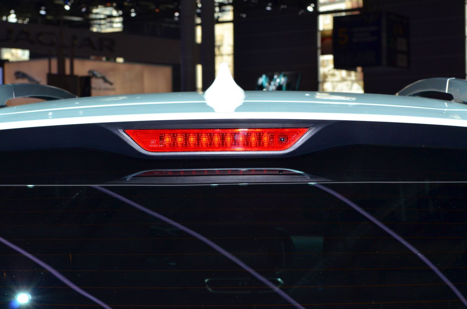 Close-up of rear window and roof brake light