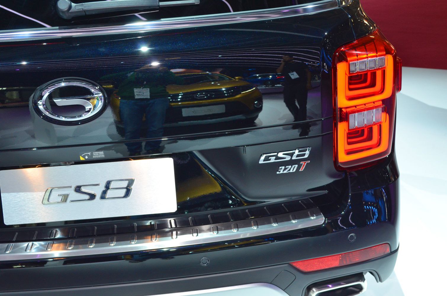 Close-up of rear taillight and GS8 emblem on SUV rear.