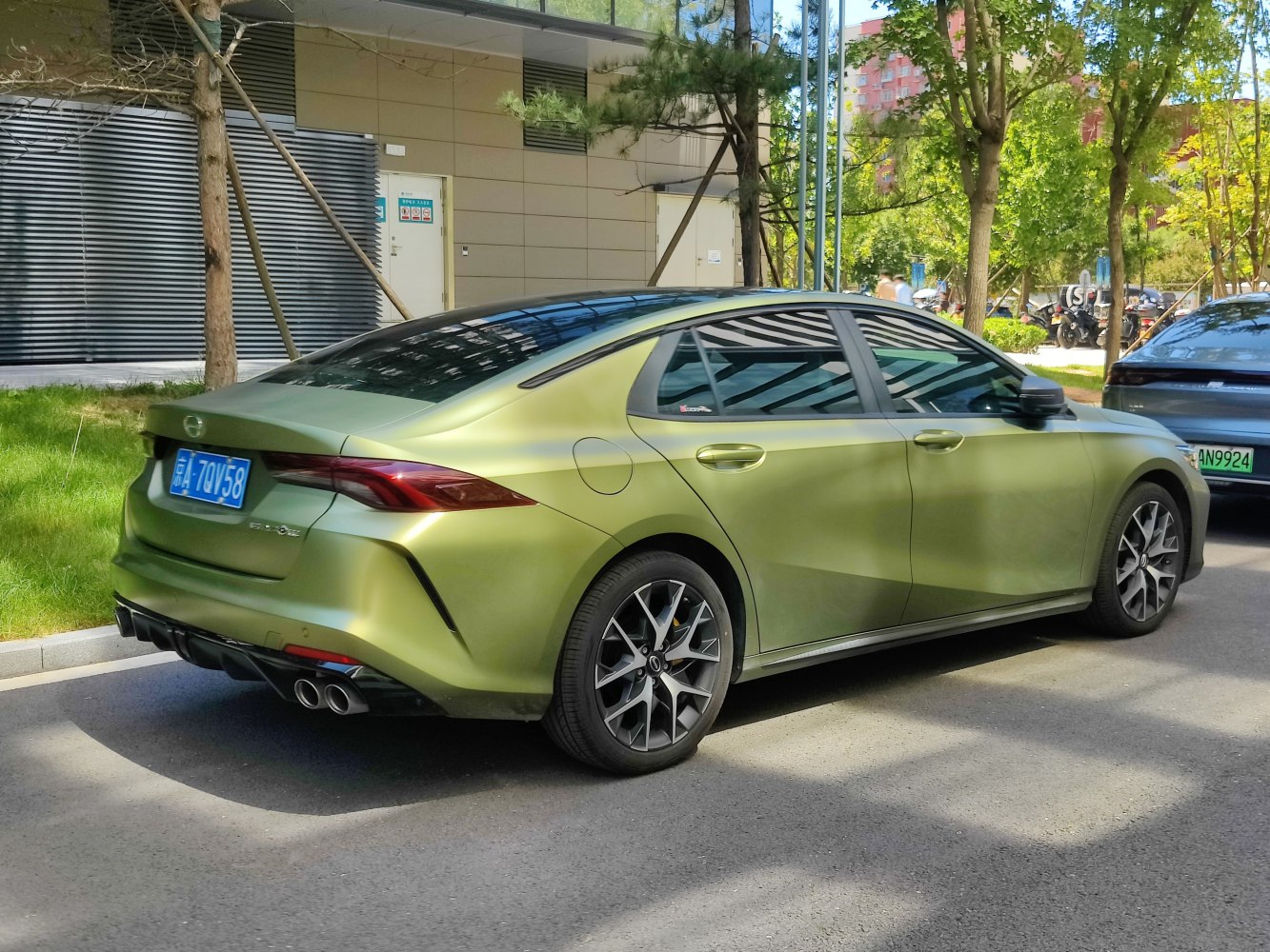 Rear profile and sporty alloy wheels of a modern sedan