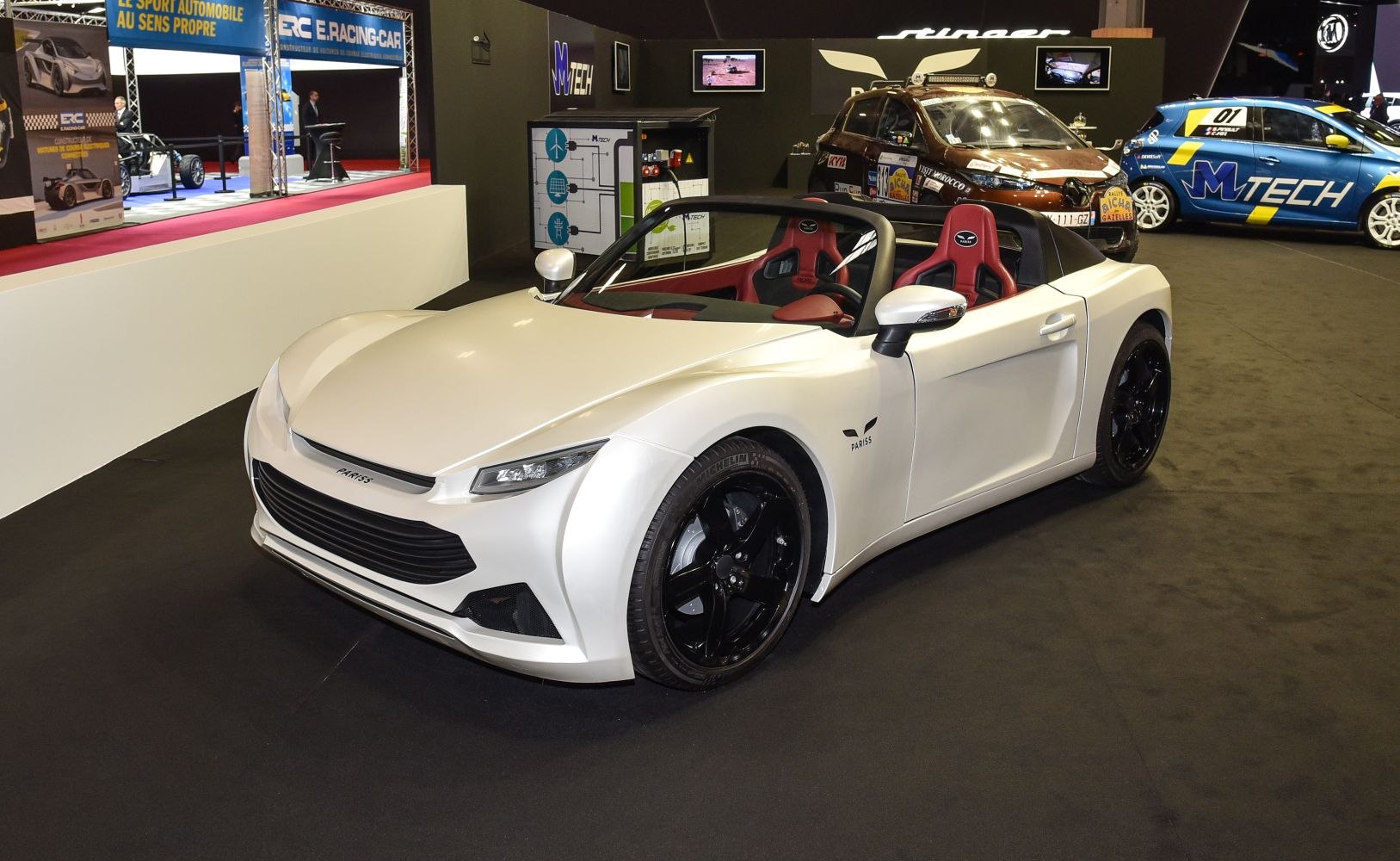 White convertible with black wheels and red sport seats