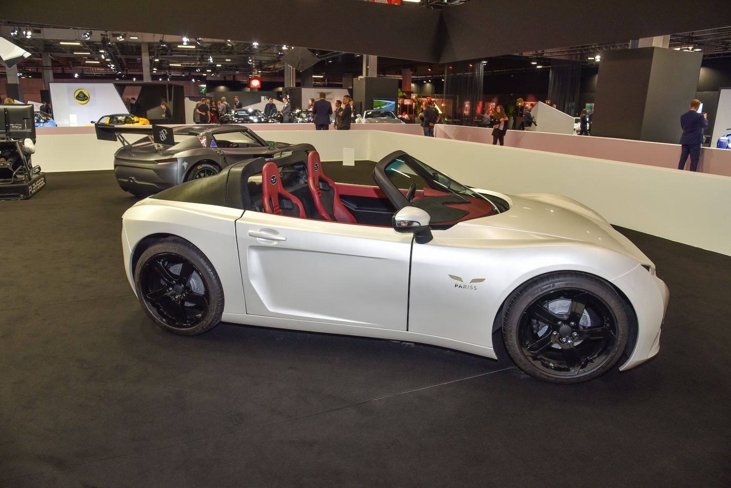 Convertible electric roadster with sporty red seats