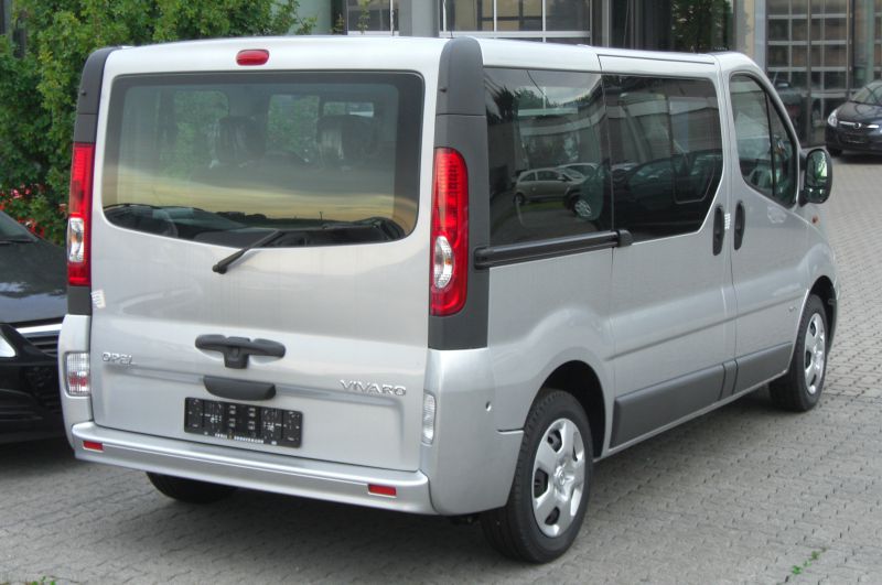 Rear view with vertical taillights and large rear window of a passenger van
