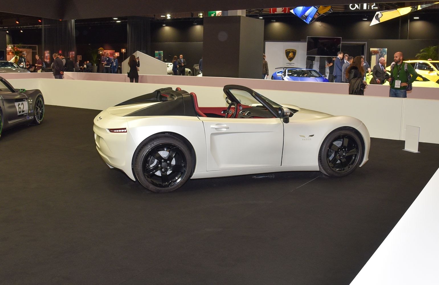 Sleek open-top roadster with black alloy wheels and low profile