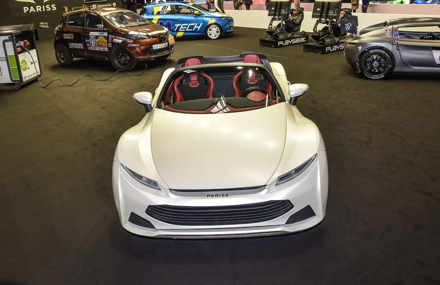Front view of sleek modern convertible sports car with racing seats.