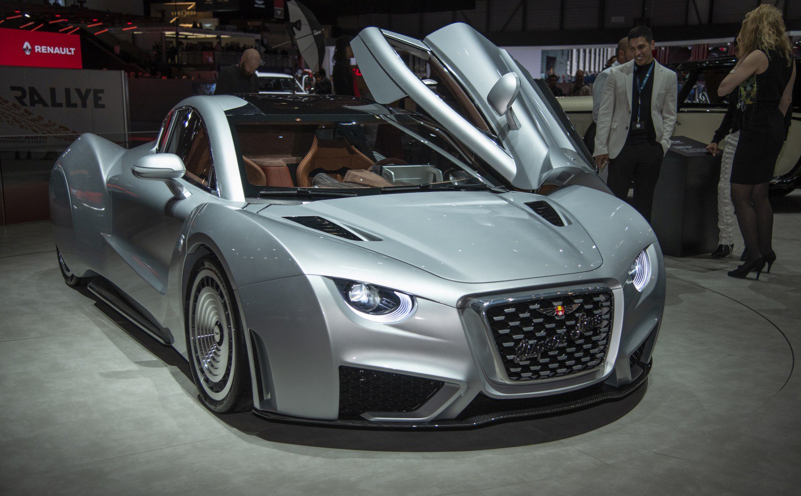 Silver sports coupe with gull-wing doors and aerodynamic design