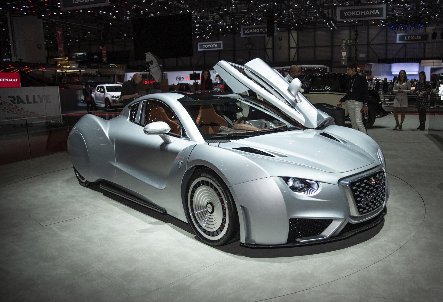 Sleek aerodynamic body, gull-wing doors, futuristic wheels, and side mirrors