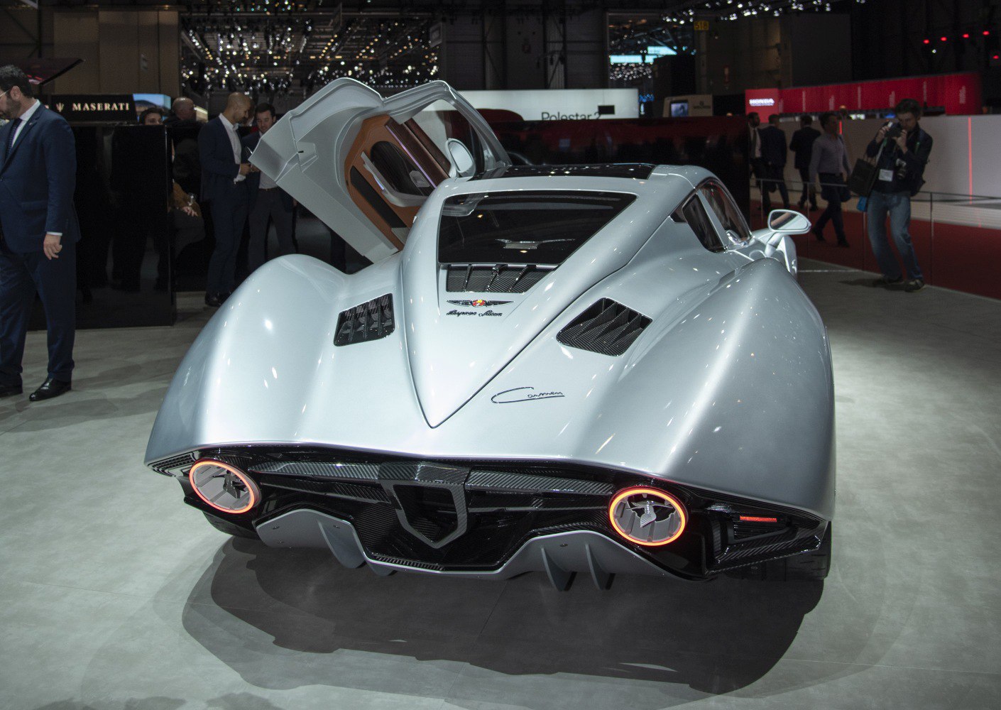 Sleek rear design with round tail lights and butterfly door