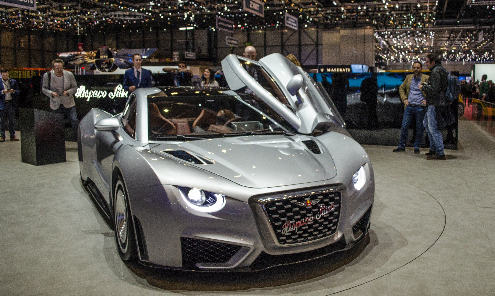 Silver sports car with butterfly doors and LED headlights