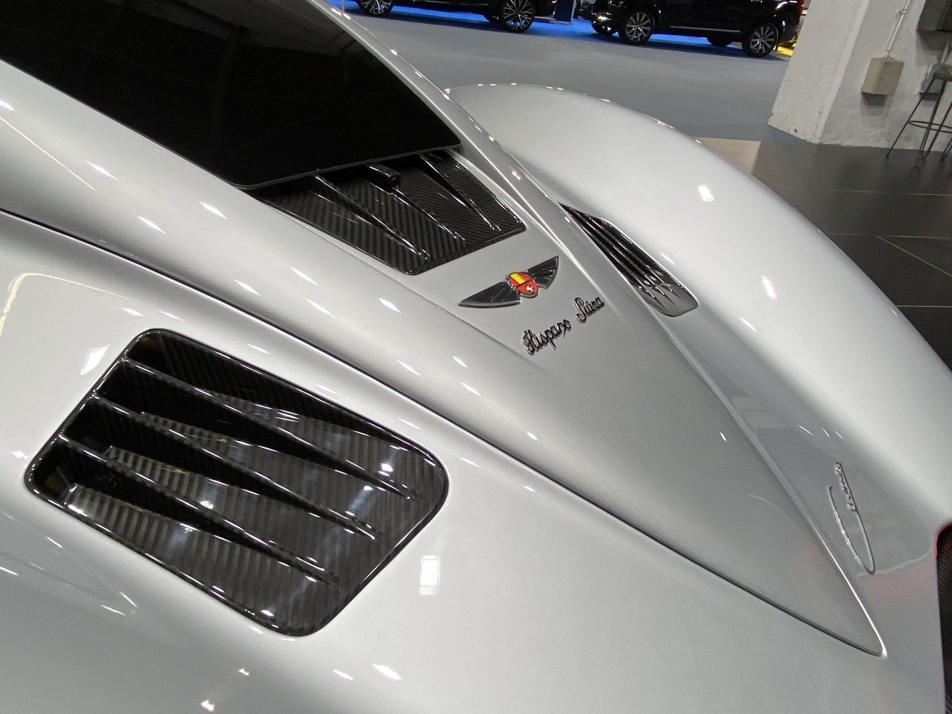 Carbon fiber aerodynamic vent on smooth white body
