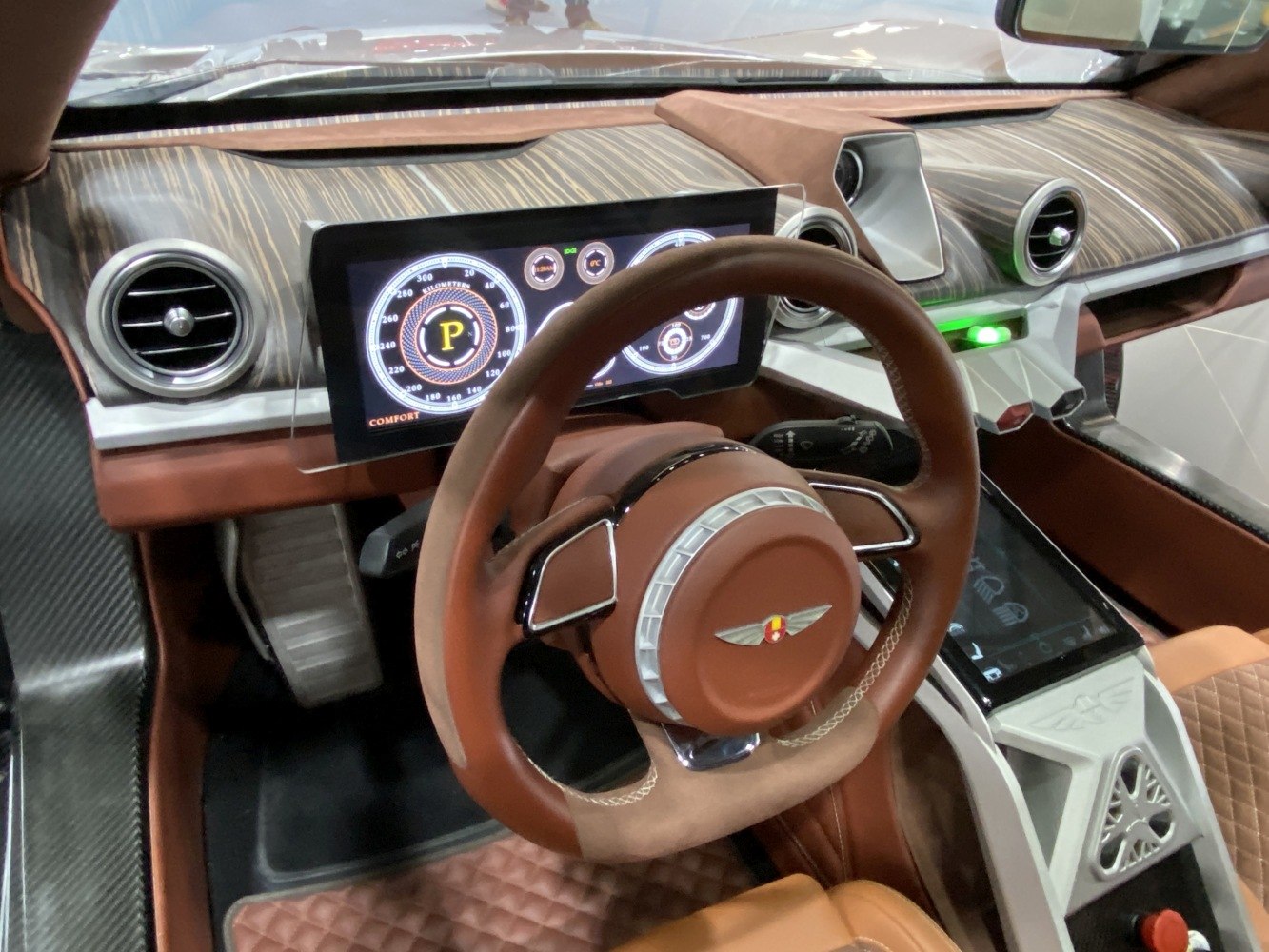 Luxury car interior with digital dashboard and leather steering wheel