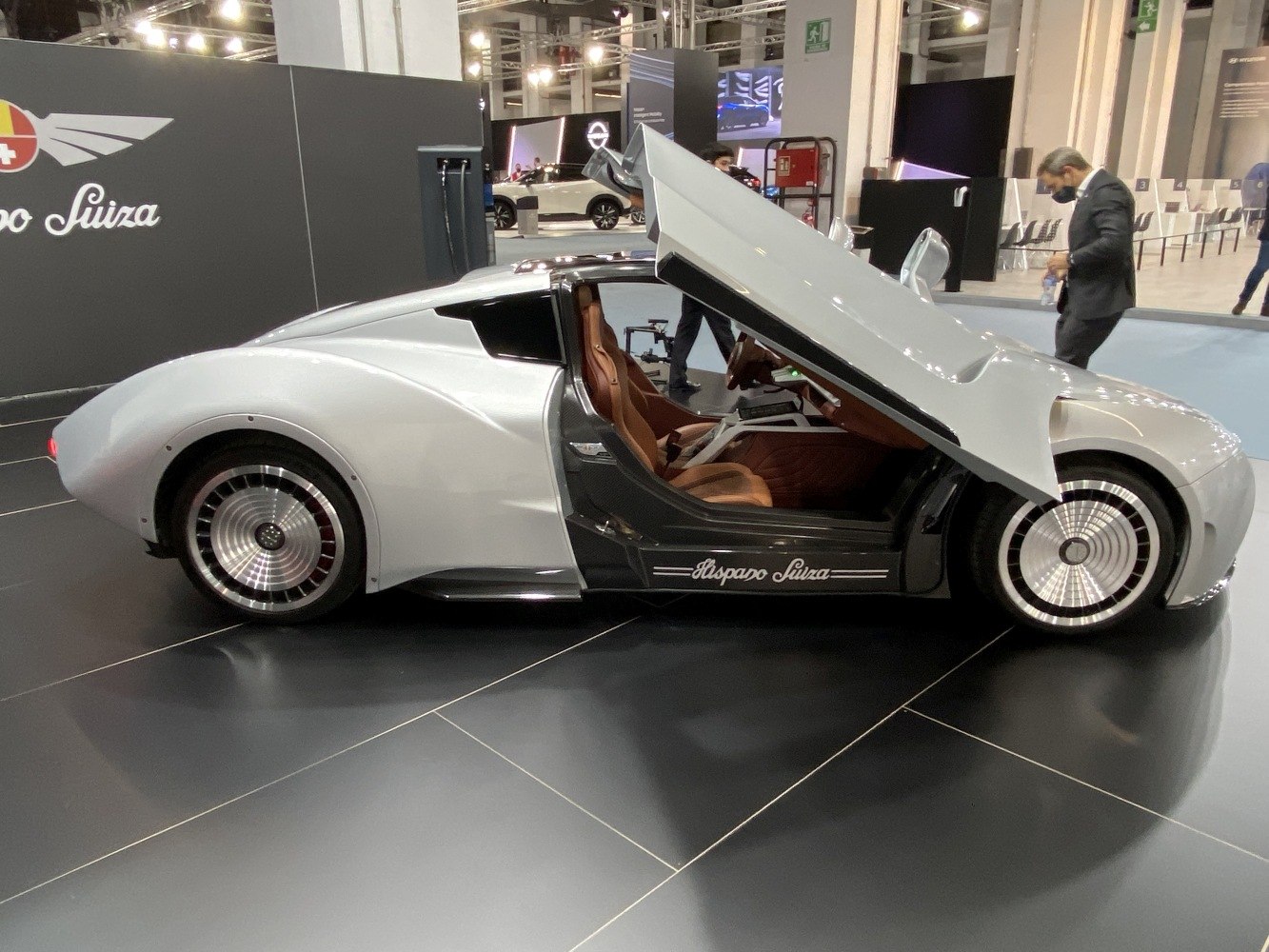 Sleek sports coupe with gullwing doors and turbine-style wheels