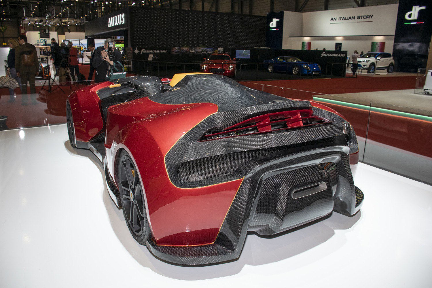 Rear view of a quad vehicle featuring carbon fiber bodywork and aerodynamic elements