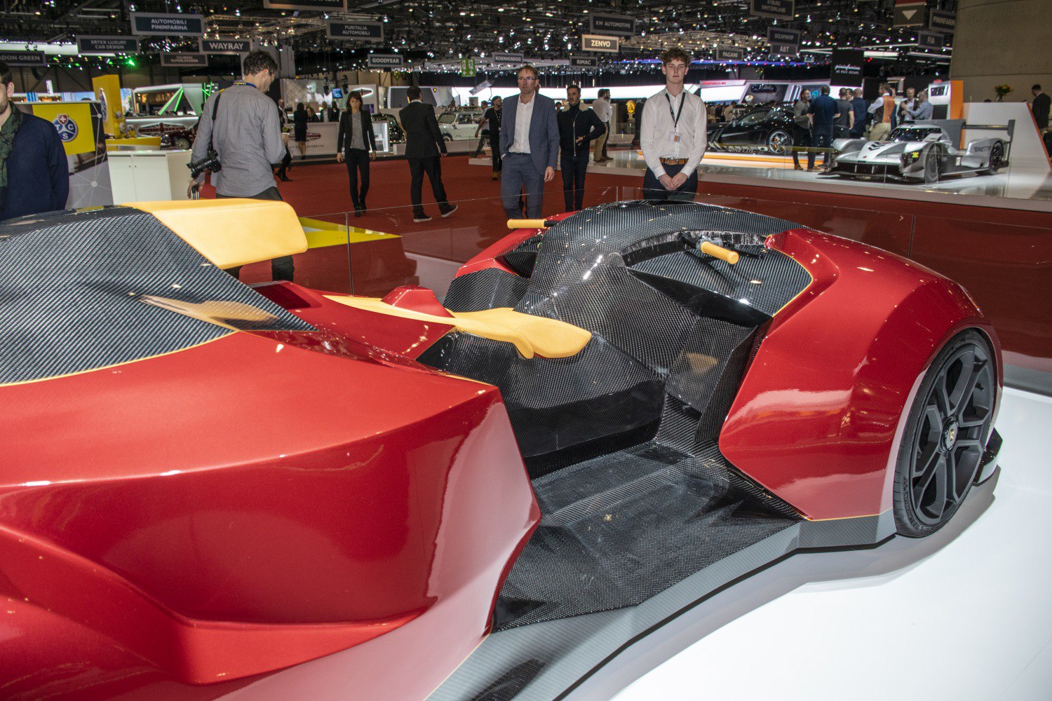 Open cockpit with exposed carbon fiber and racing-style controls