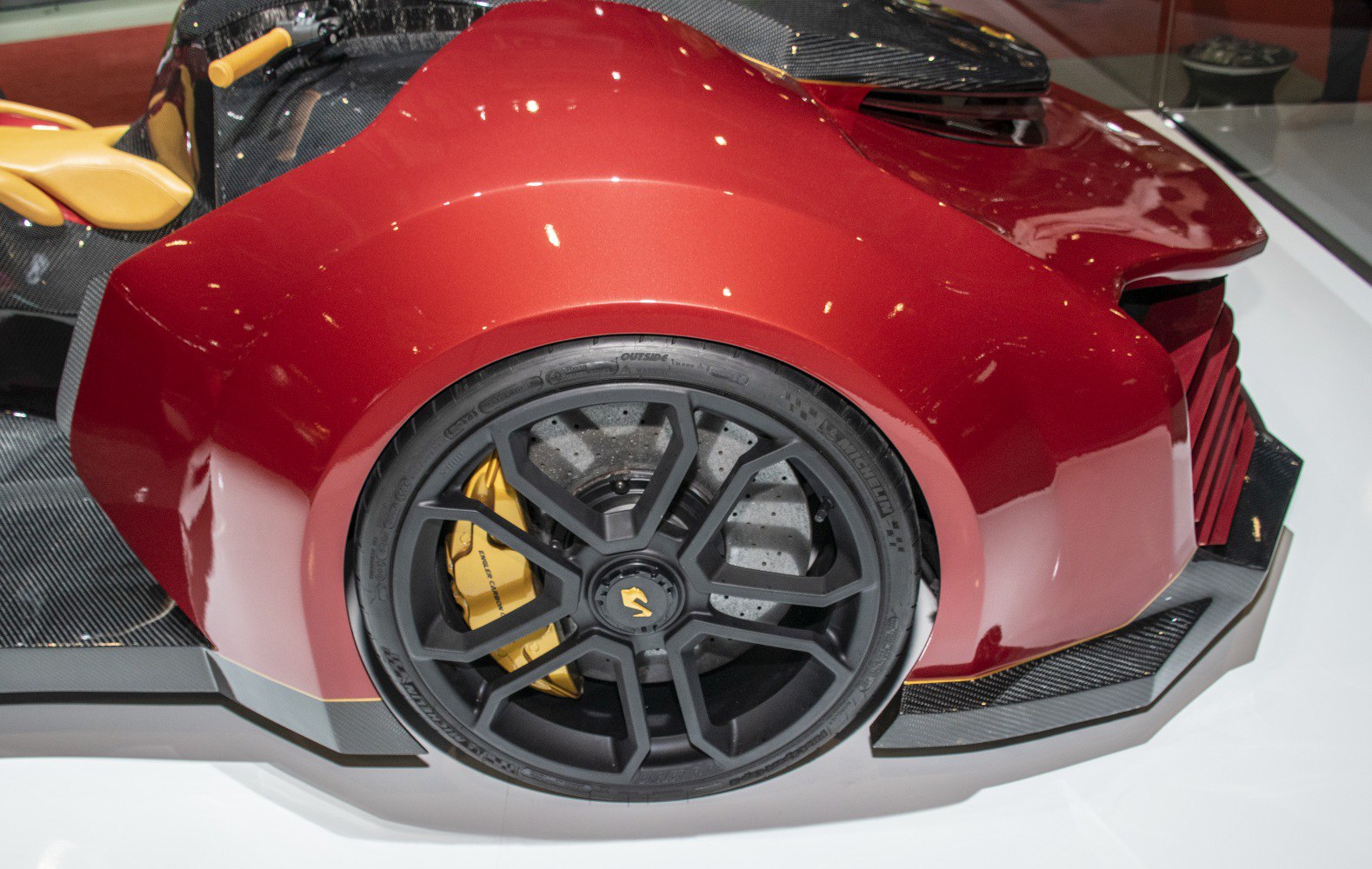 Close-up of rear wheel with performance brake and aerodynamic bodywork.
