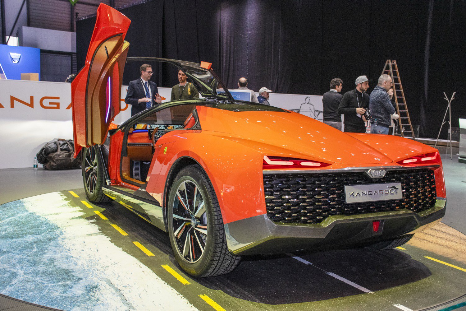 Futuristic rear design and gullwing doors on orange concept sportscar