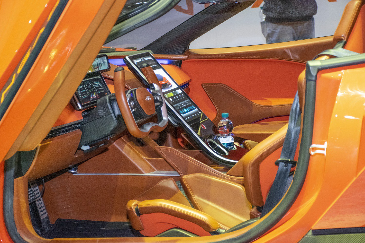 Orange leather interior with futuristic steering and digital dashboard