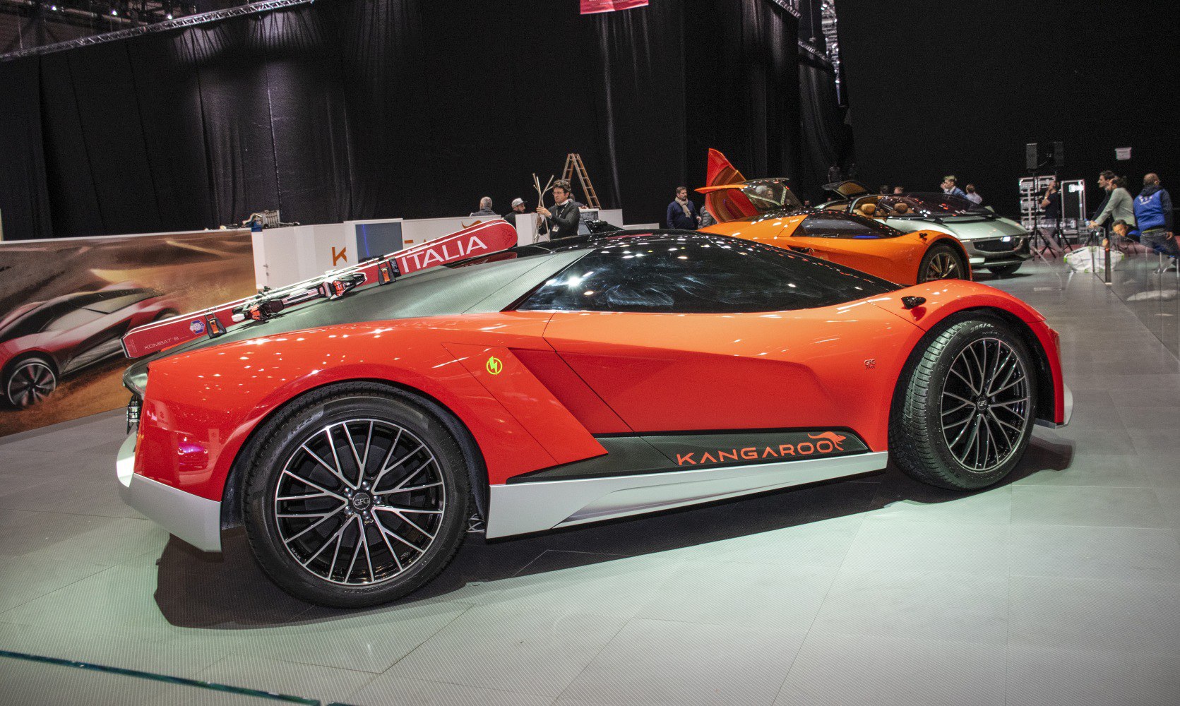 Sleek side profile of electric sports car with aerodynamic design and modern wheels.