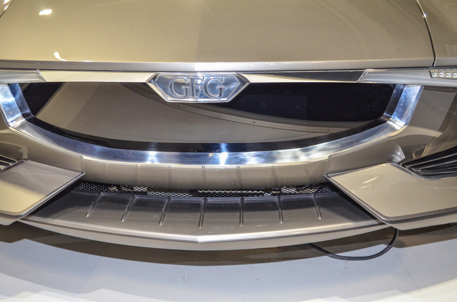 Close-up of a car's front grille with chrome trim and emblem