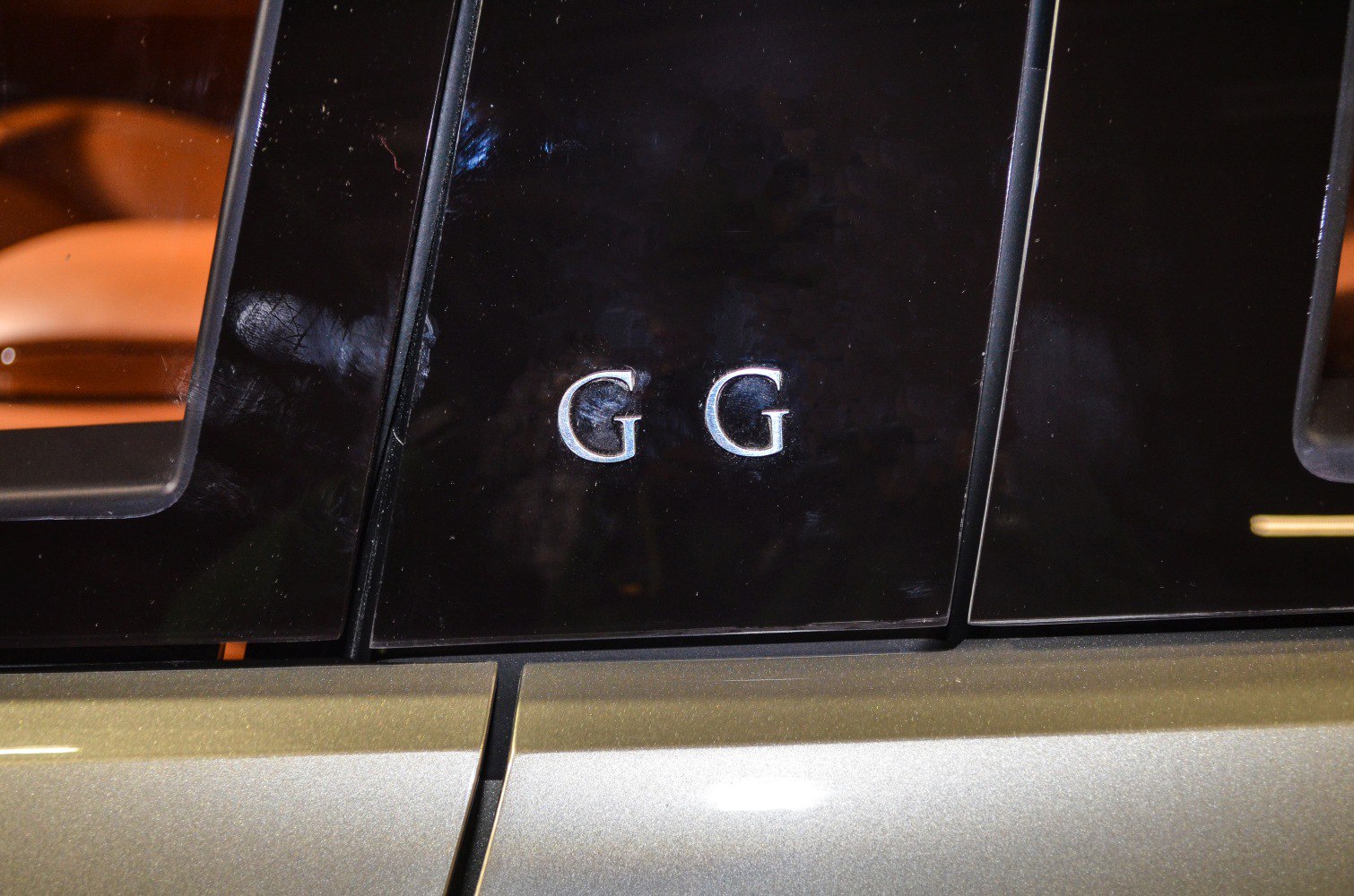 Close-up of GFG emblem on car exterior panel