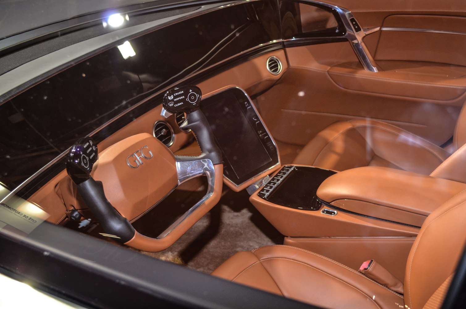 Futuristic steering wheel and brown leather luxury interior