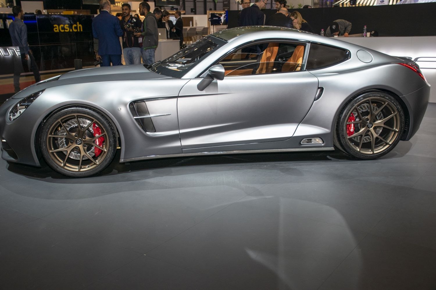 Side profile with alloy wheels, red brake calipers, and aerodynamic side vents