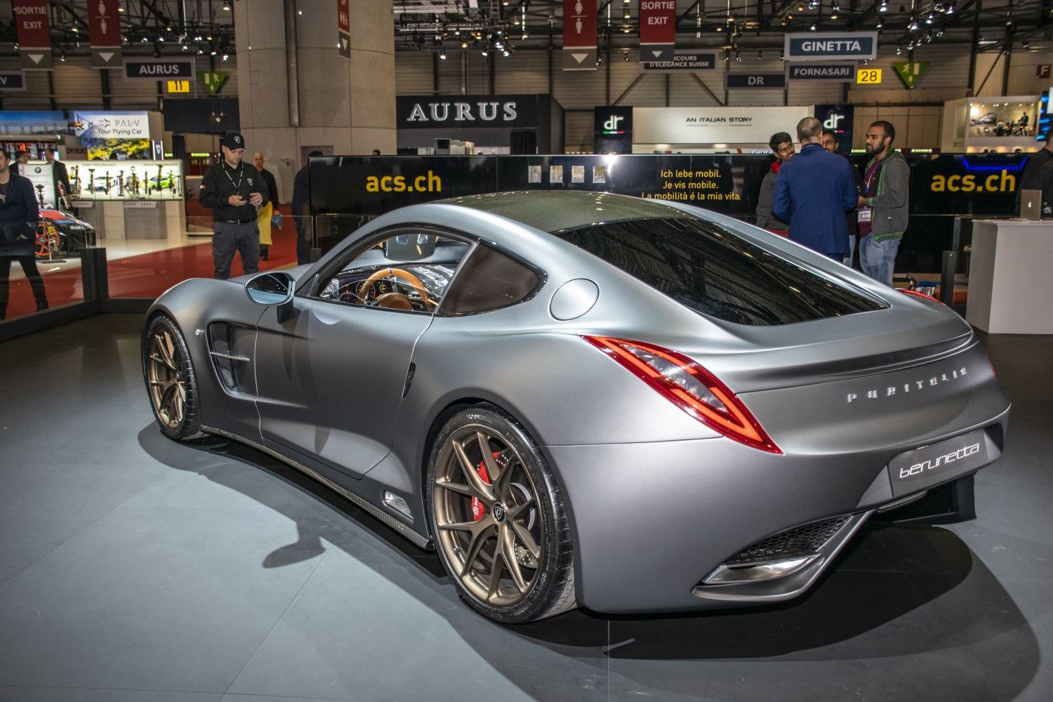 Sleek rear side view of sporty coupe with aerodynamic design and premium wheels