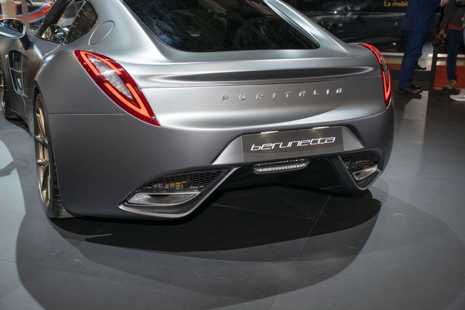 Sleek rear view with distinctive tail lights and aerodynamic bumper.