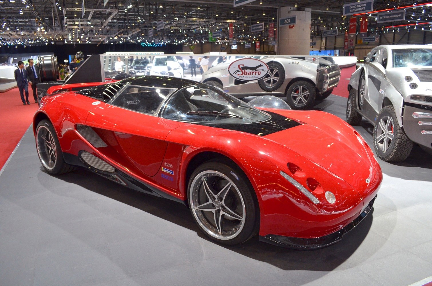 Red sports coupe with aerodynamic body and racing alloy wheels