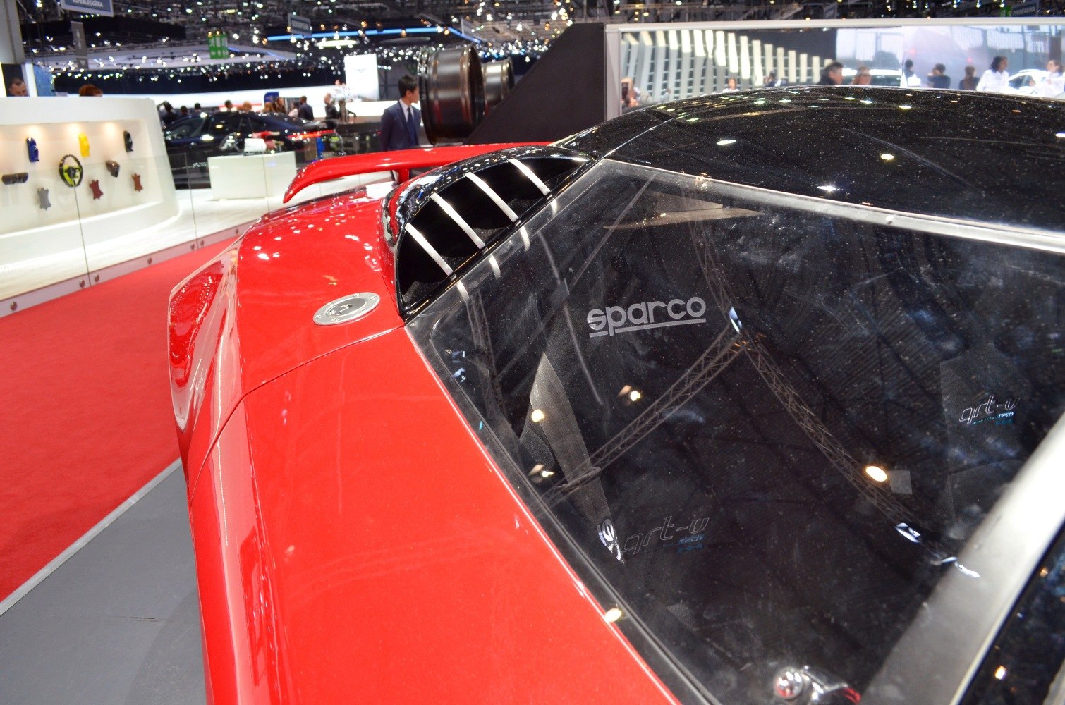 Side air vents and Sparco-marked rear window detail