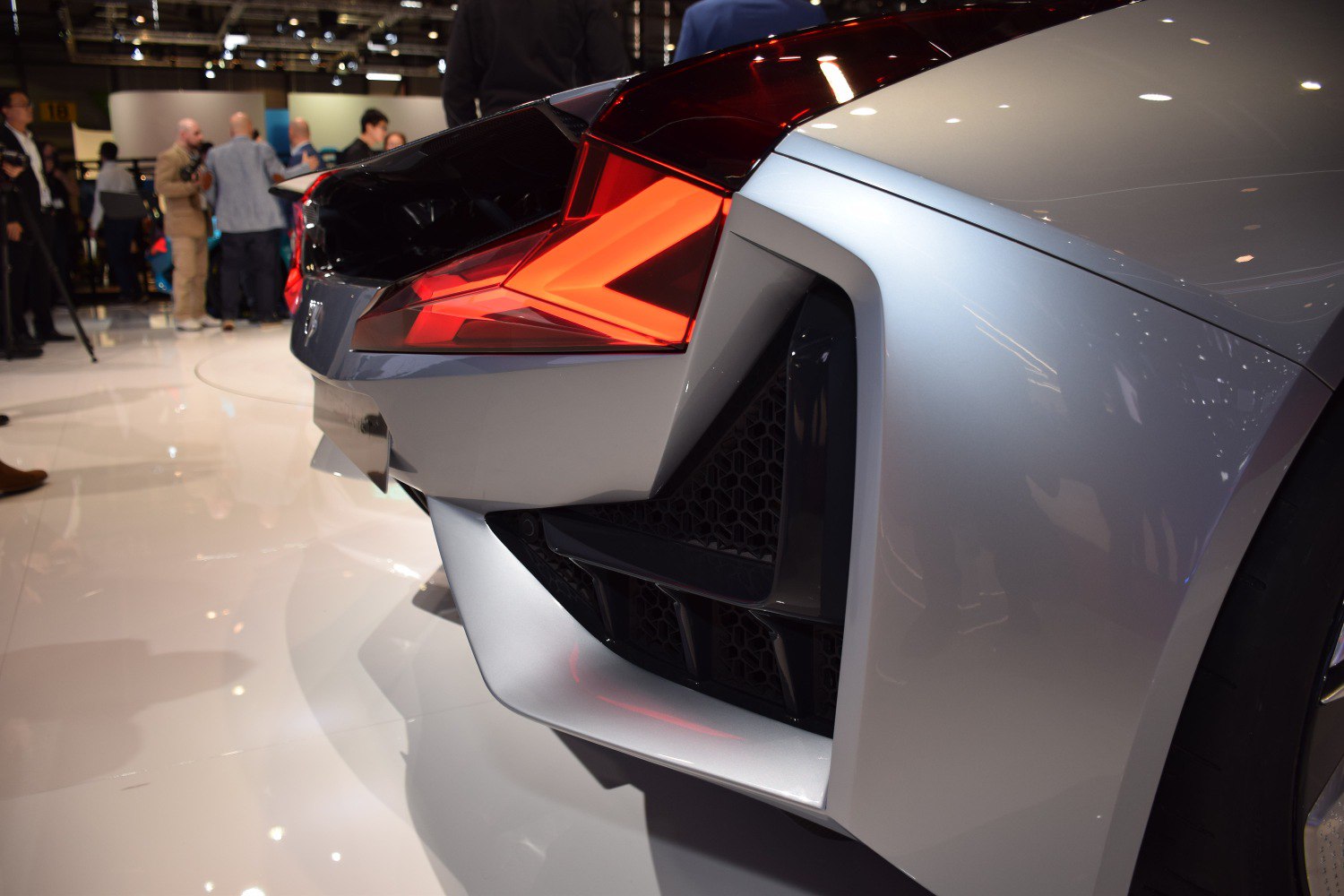 Close-up of rear LED tail light and aerodynamic bumper design.