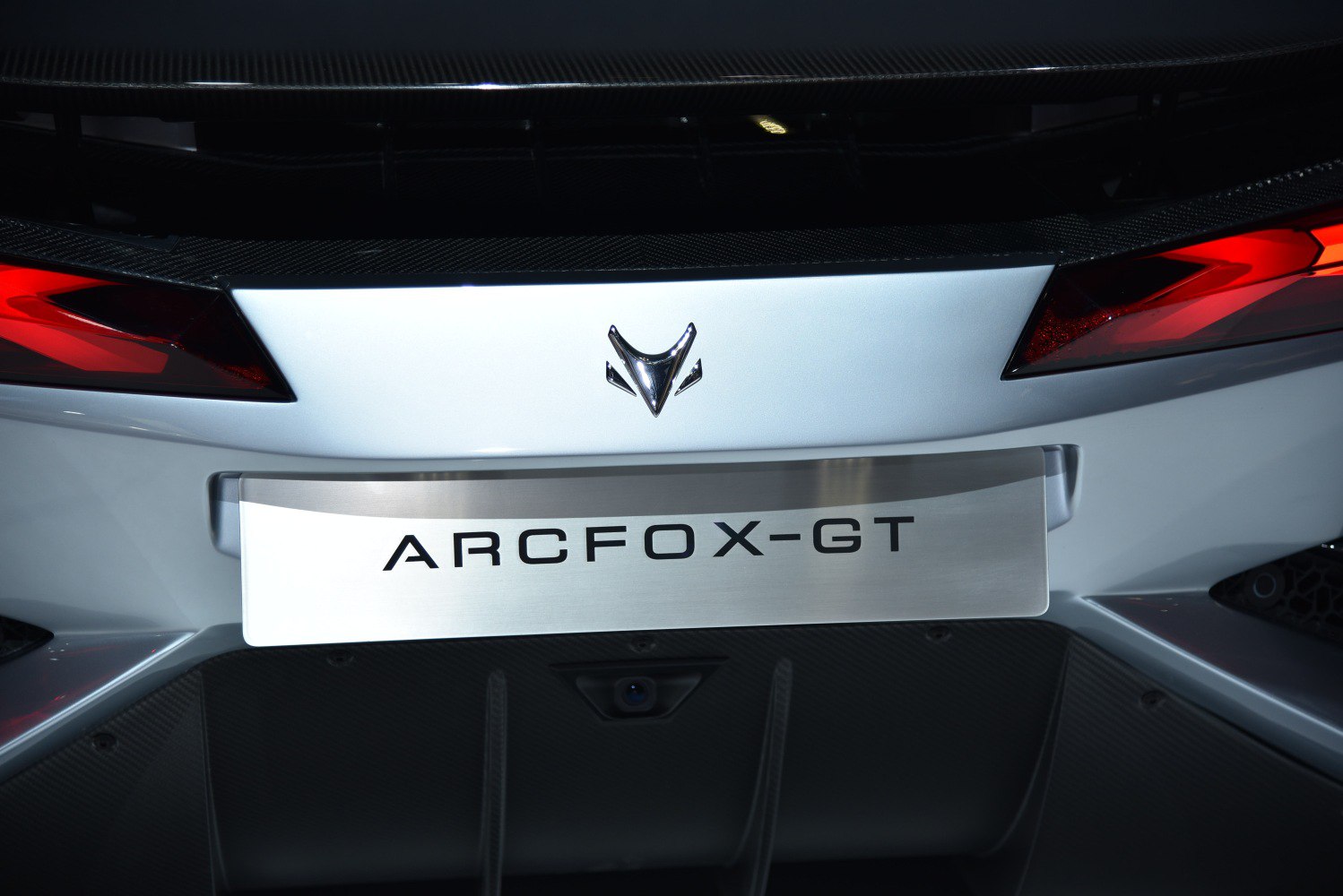 Rear tail lights, brand badge, and diffuser close-up