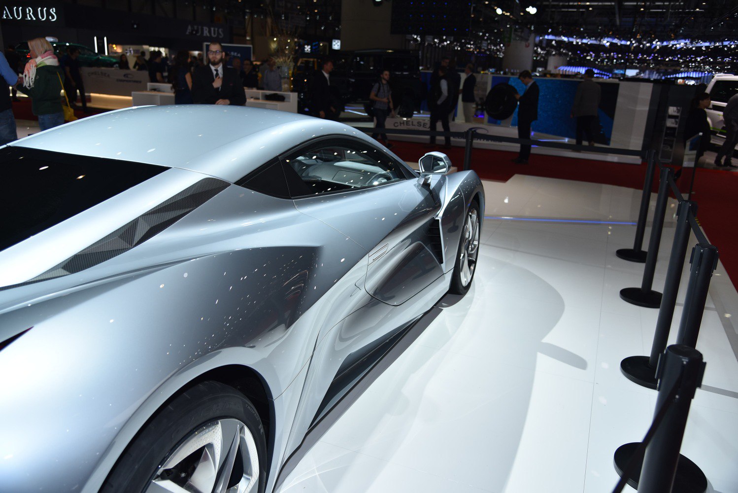 Sleek silver coupe with aerodynamic side air vents and sculpted panels