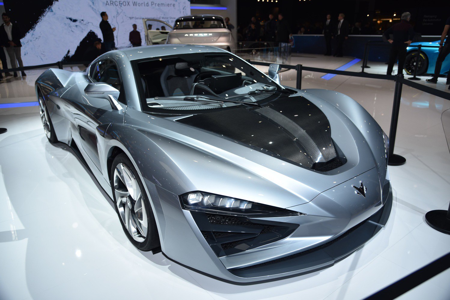 Carbon fiber hood and aggressive LED headlights on a futuristic sports coupe