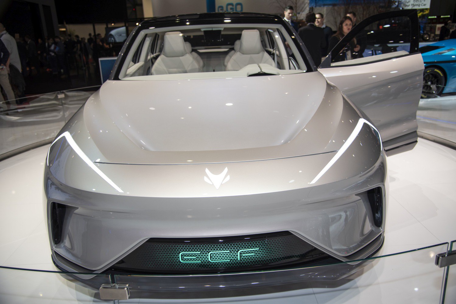 Sleek front design with LED headlights and visible interior seats