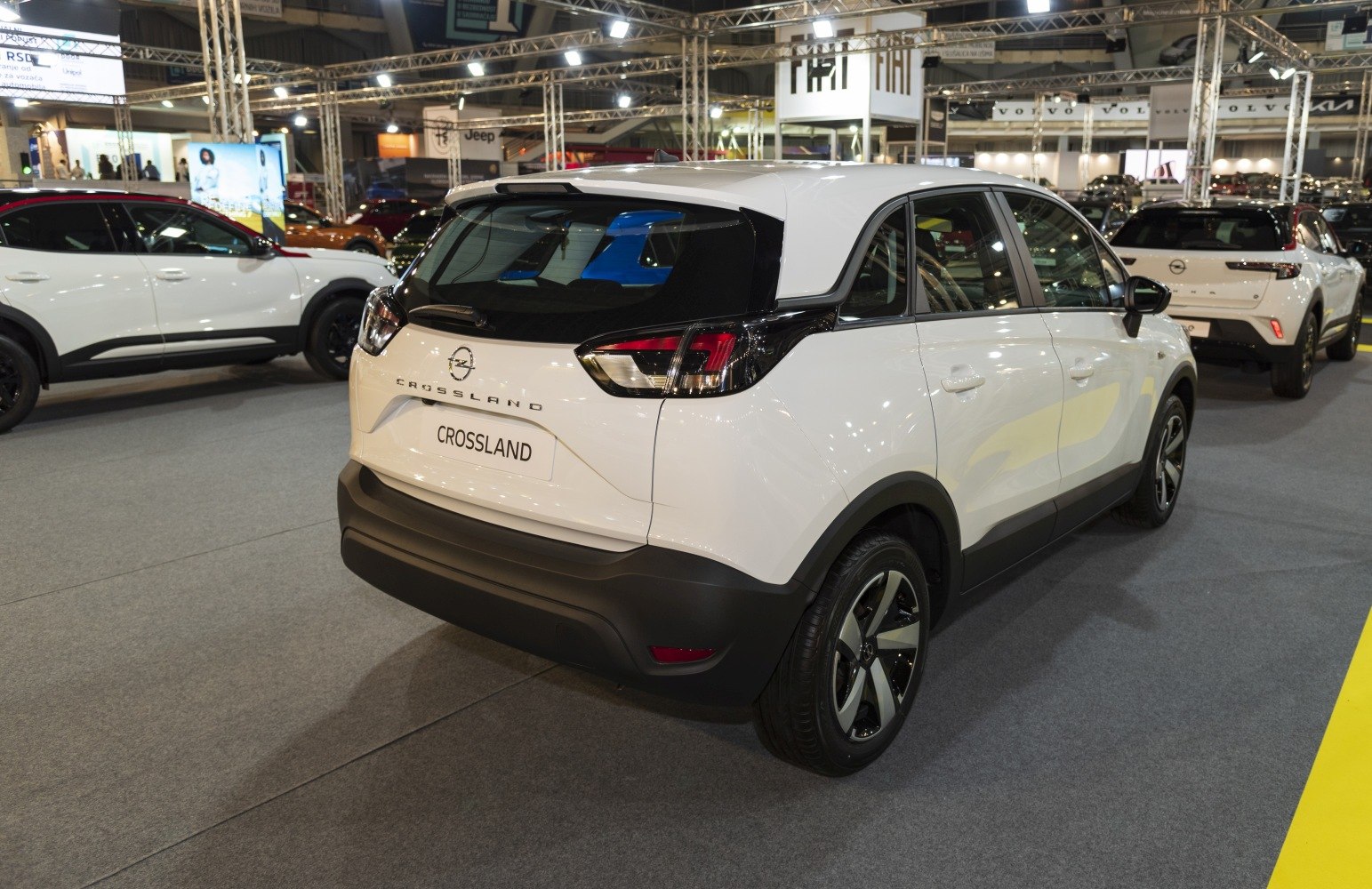 Rear and side view of a white modern compact SUV with distinctive taillights and alloy wheels