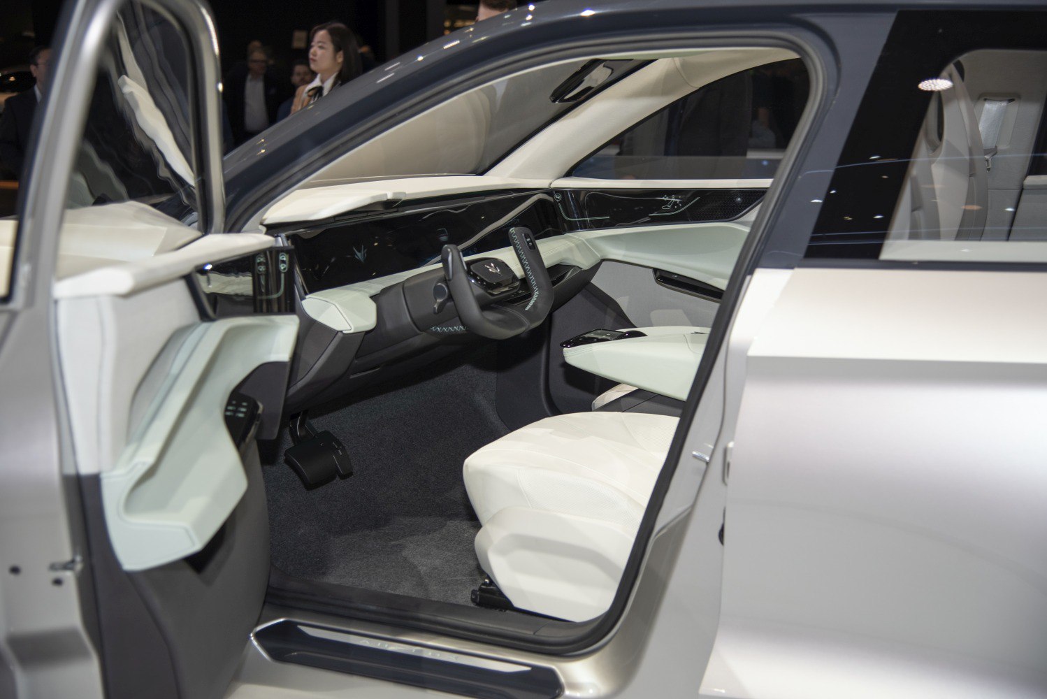 Futuristic car interior with digital dashboard and unique steering wheel