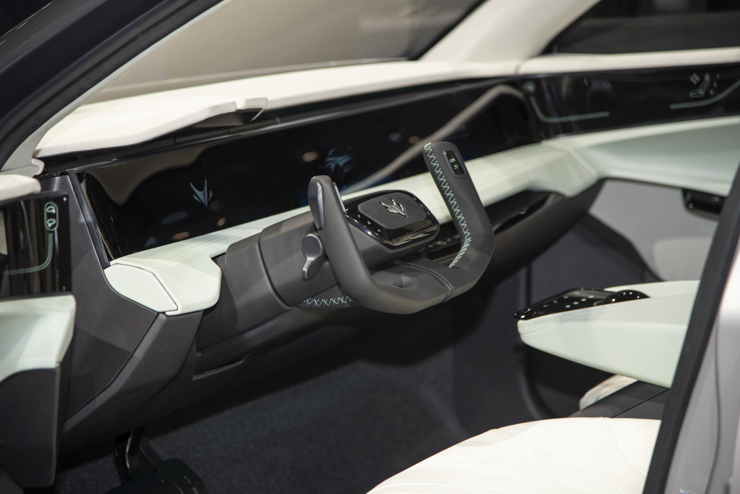 Futuristic steering wheel and sleek digital dashboard