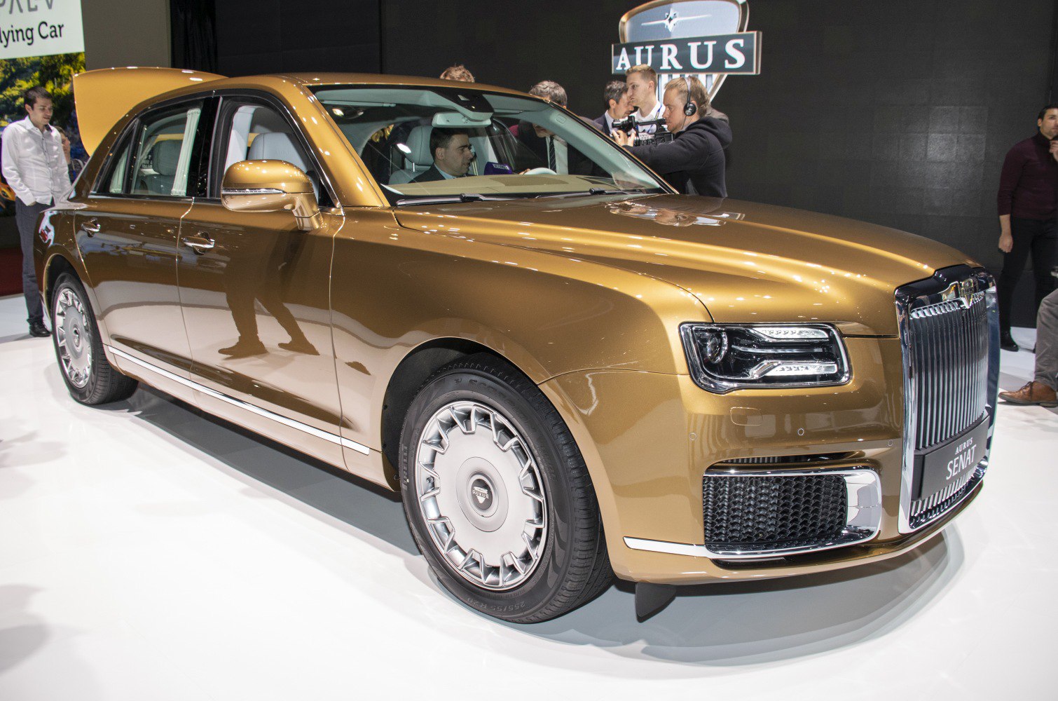 Luxury sedan front view with LED headlights and chrome grille