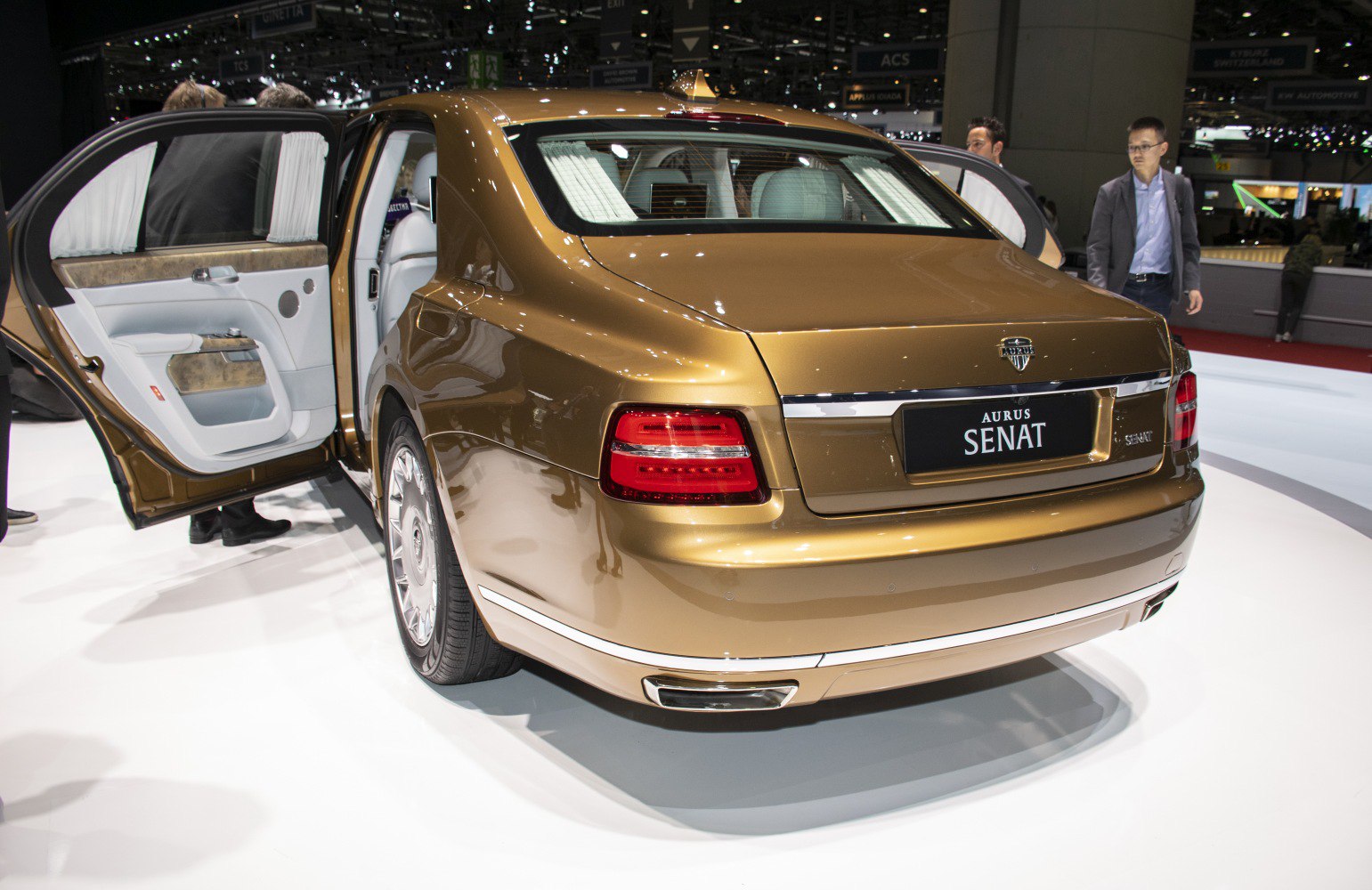Rear view of luxury sedan with open rear door