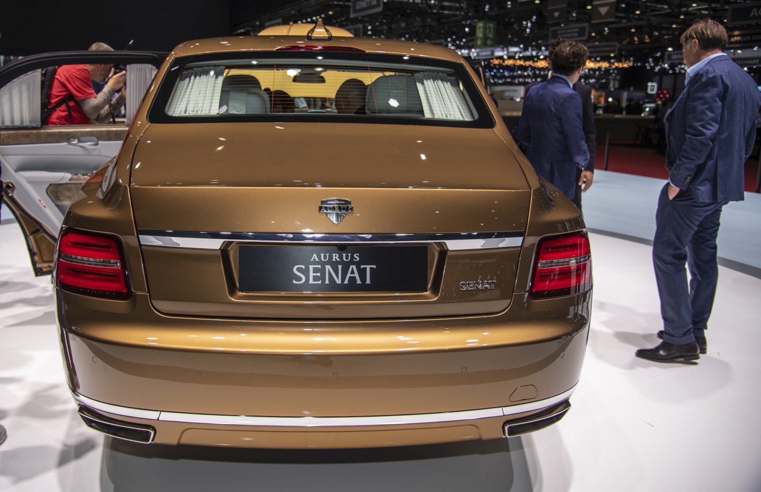 Rear view with tail lights and chrome trim