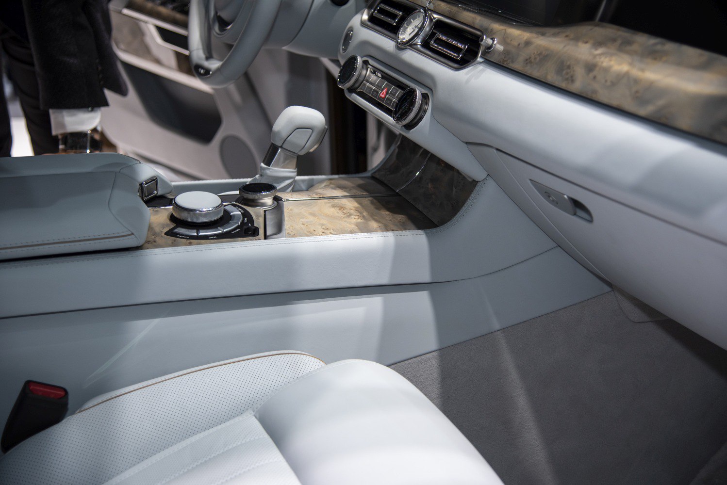 Luxury interior with wood trim and plush white leather seats