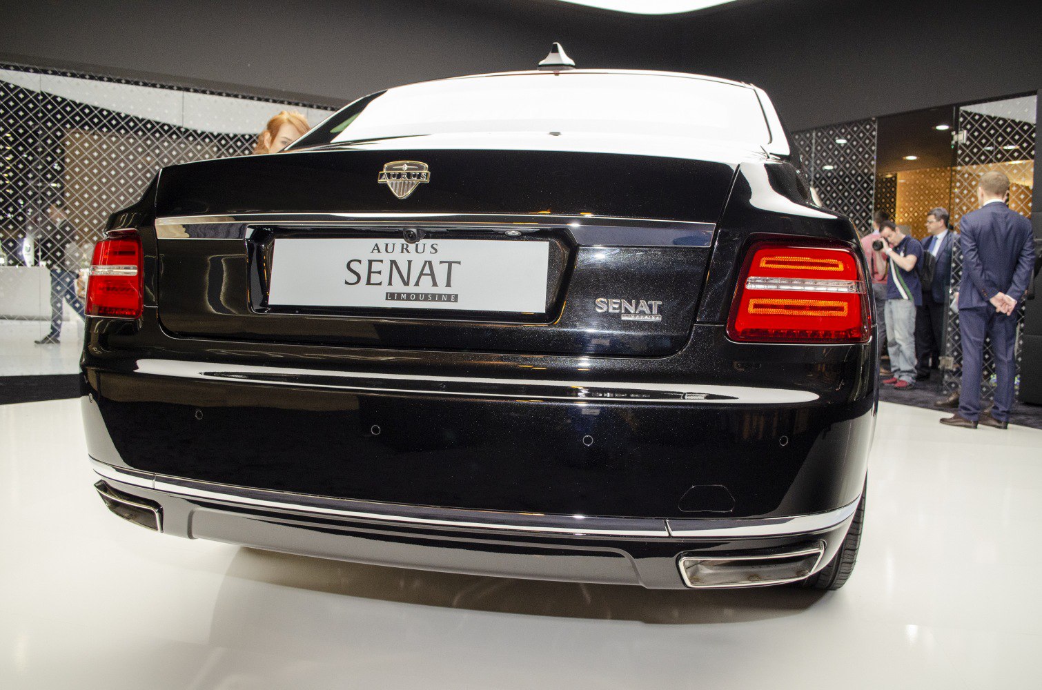 Rear view of luxury sedan with distinctive tail lights and rear bumper