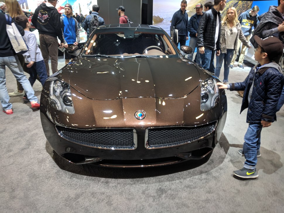 Front close-up of luxury sports coupe with distinctive grille and headlights