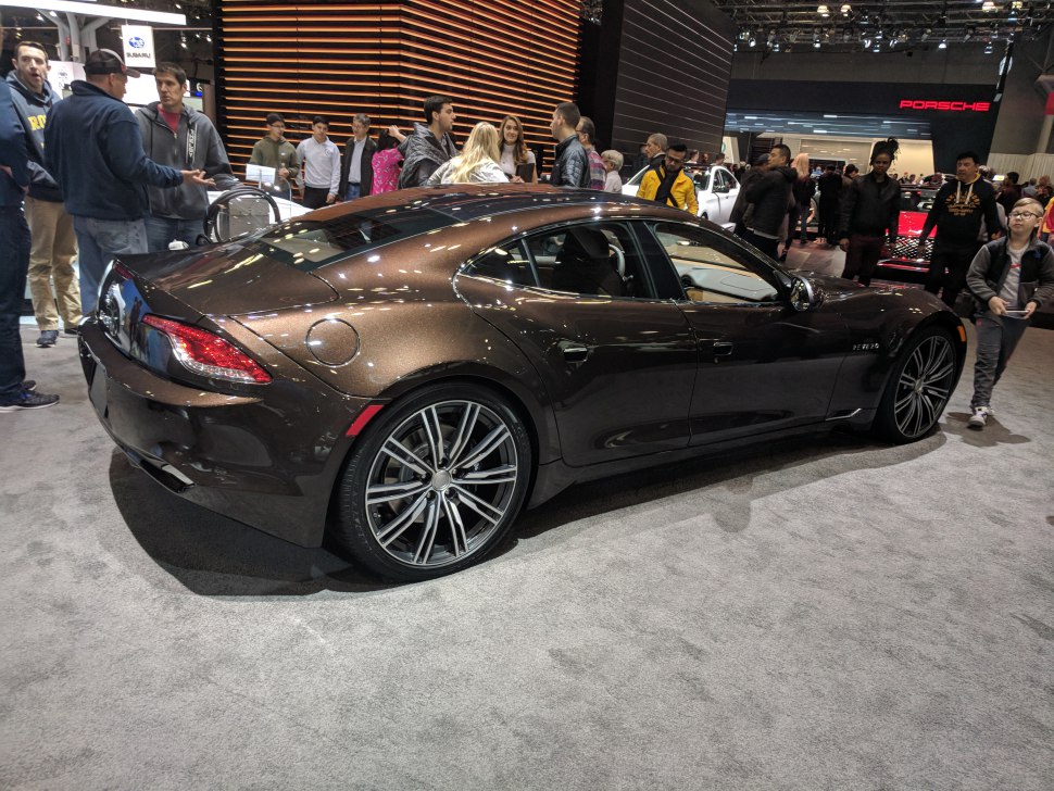 Sleek rear side profile with distinctive taillights and alloy wheels